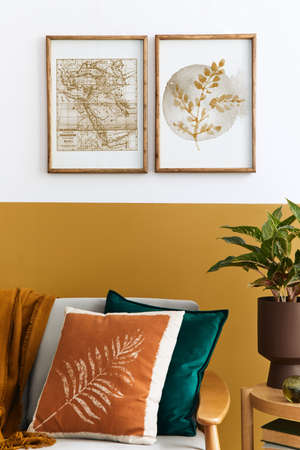 Interior design of modern living room with two mock up poster frames, elegant sofa, plant, pillow...