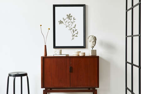 Modern retro concept of living room interior with design teak commode, black mock up poster frame,...