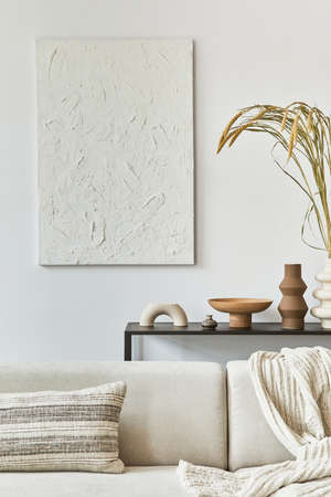 Stylish composition of creative living room interior design with mock up structure painting, corner sofa, coffee table, textile and personal accessories. Scandinavian classic style. Template,の写真素材