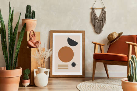 Creative composition of stylish living room interior with mock up poster frame, armchair, cacti and personal and boho accessories. Plant love and nature concept. Template.の写真素材
