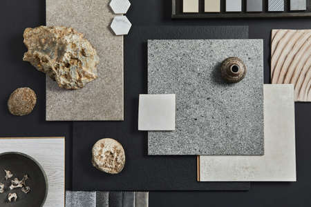 Flat lay composition of creative black architect moodboard with samples of building, textile and...
