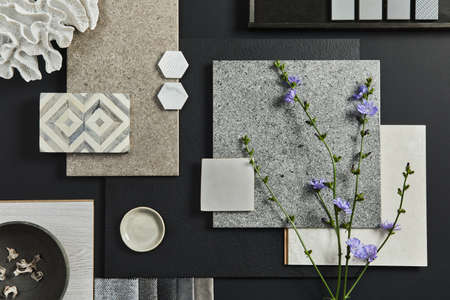 Flat lay composition of creative black architect moodboard with samples of building, textile and natural materials and personal accessories. Top view, black backgroung, template.の写真素材