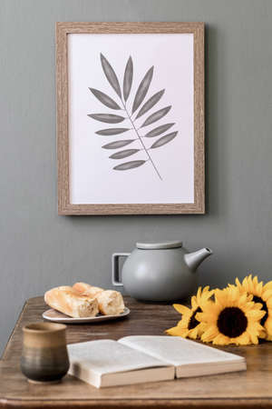 Cozy and stylish composition of creative dining room with mock up poter frame, wooden consola,...