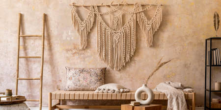 Interior design of stylish living room with chaise longue, beautiful macrame, rattan decoration,...