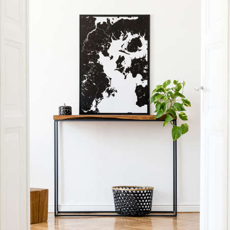 Creative composition of home interior design with mock up poster frame, wooden consola, books and...