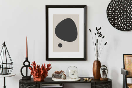 Stylish living room interior design with console and mock up poster frame. Candles, gemstones and vintage personal accessories. Copy space. Template.の写真素材