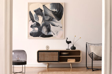 Stylish composition of modern interior design with rattan commode, mock up painting, lamp and...
