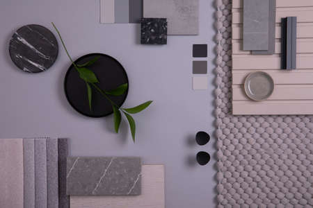Elegant flat lay composition in gray and black color palette with textile and paint samples, lamella panels and tiles. Architect and interior designer moodboard. Top view. Copy space.の写真素材