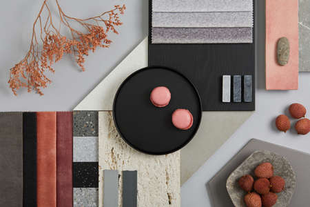 Creative flat lay composition with textile and paint samples, panels and tiles. Stylish interior...