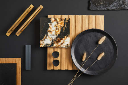 Stylish flat lay comosition of creative architect moodboard with samples of textile, paint, wooden...