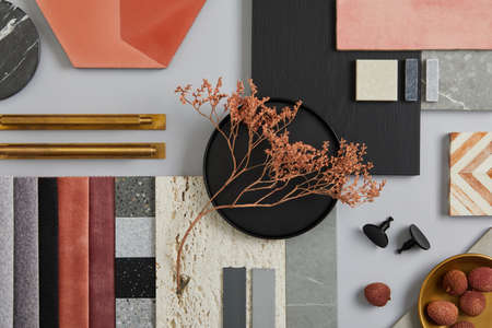 Creative flat lay composition with textile and paint samples, panels and tiles. Stylish interior designer moodboard. Pink, black and light gray color palette. Copy space. Template.の写真素材
