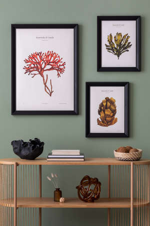 The stylish boho composition at living room interior with wooden console and elegant personal...