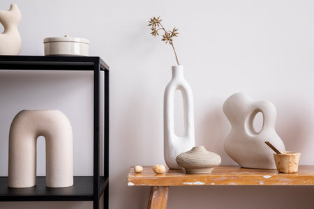 Scandinavian composition with black console, wooden bench,dried flowers in white vase, candlestick, and personal accessories. Stylish and minimalist home decor. template.の写真素材