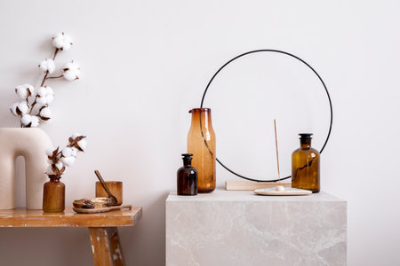 Scandinavian composition with wooden bench, decoration, dried flowers in vase and personal accessories. Stylish and minimalist home decor. template.の写真素材