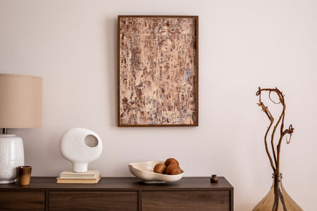 Interior design of aesthetic and elegant room with mock up poster, wooden commode, glass vase, decoration and personal accessories. Elegant home decor. template.の写真素材