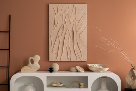 Minimalist composition of living room interior with mock up poster frame, white commode, ladder, vase with dried flowers, modern sculpture, casket, bowl and personal accessories. home dÃ©cor. template.の写真素材