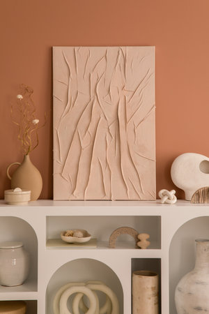 Cozy composition of living room interior with mock up poster frame, white commode, modern sculptures, vase with dried flowers, casket and personal accessories. home dÃ©cor. template.の写真素材