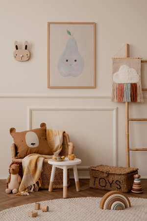 Cozy ids room interior with mock up poster frame, plush toys, brown pillow, braided armchair, round stool, ladder with ornament, beige wall with stucco and personal accessories. home dÃ©cor. template.の写真素材