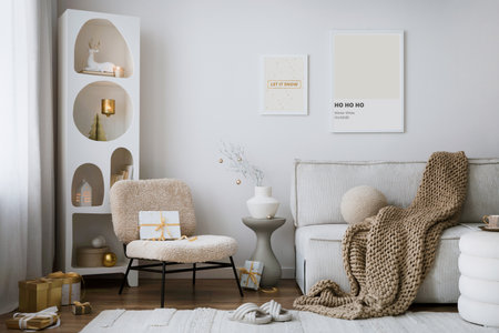 Domestic and cozy christmas living room interior with mock up poster frames, beige sofa, design armchair, christmas decoration, wreath, stars, gifts and accessories. Family time. Template.の写真素材