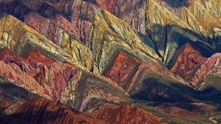A detail of the multicolored mountain known as Serrania del Hornocal, Jujuy province (Argentina). This fascinating geology is a limestone formation with minerals being eroded stripped to a symphony of colors on the mountainsides. Definitely one of the wonのeditorial素材