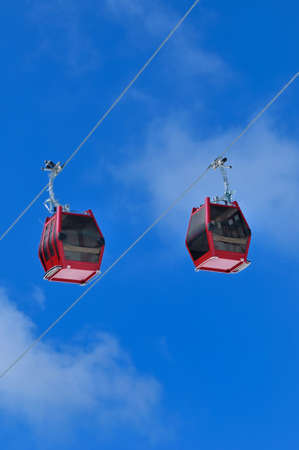 Red cable car on snow mountain, Chamrousse, Franceの写真素材