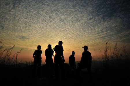 Silhouette people sunset at Khao chang puek mountain, Kanchanaburi, Thailand