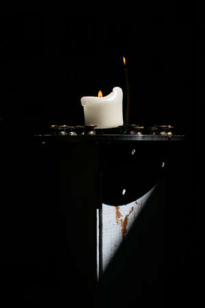   Candle on a black background