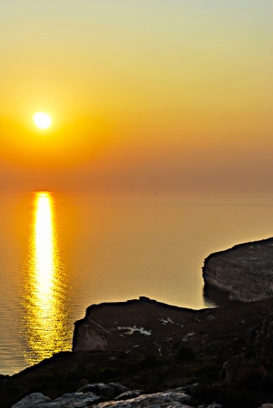 Nice sunset reflected in mediterranean coastの写真素材