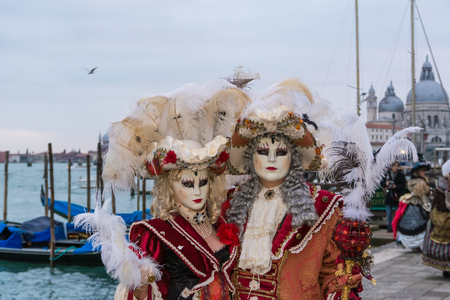 A couple of masked people in Venice carnivalの写真素材