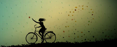 Autumn rain, girl riding on the bicycle and autumn leaves swirling and rain starte