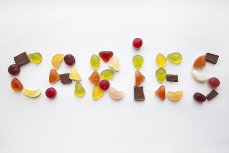 The word caries is lined with sweets.の写真素材