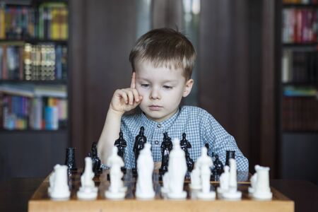 Little boy playing chess.の写真素材