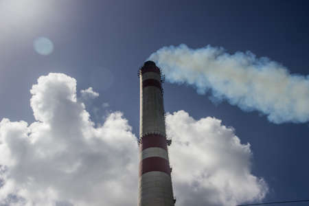 CHIMNEY,CLOUDS AND SMOKE, NEAR TO AN INDUSTRIAL ZONEの写真素材