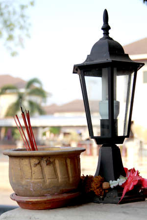 Thai joss stick pot on the wallの写真素材