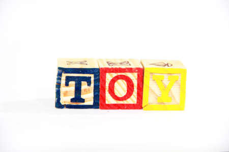 alphabet blocks on a white background spelling out the words "TOY"の写真素材