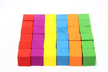 Toy blocks, multicolor wooden game cube, blank boxes isolated white backgroundの写真素材