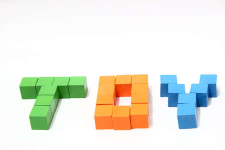 Word Toy in baby blocks,
Child s building blocks showing word toy,
Wooden toy blocks on white background.の写真素材