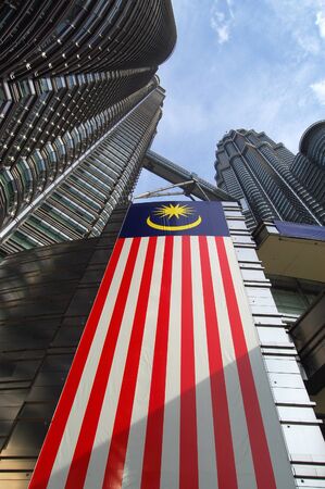KUALA LUMPUR, MALAYSIA Petronas Twin Towers, KLCC, low angle, with malaysia flag