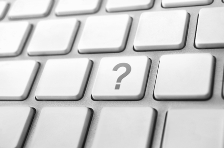 Concepts of questions or computer errors, with a question mark on keyboard.の写真素材