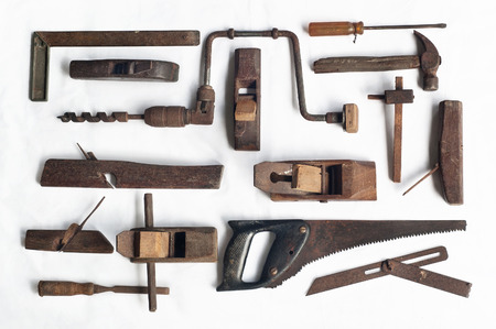 Collection of antique woodworking tools, isolated on white