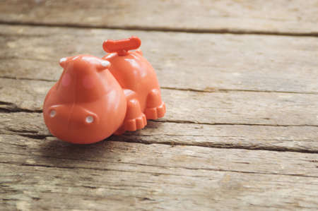 Vintage hippopotamus toy on the wooden backgroundの写真素材