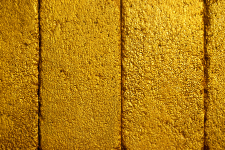 Yellow golden brick wallの写真素材