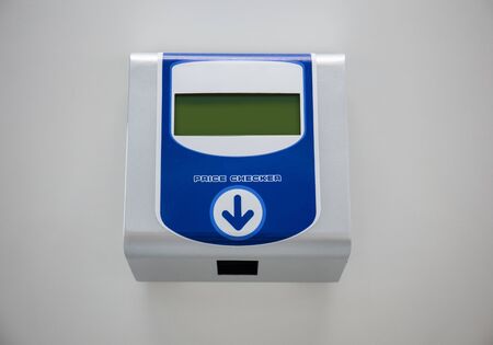 Price check machine on wall
