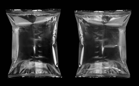 Template of food snack pillow bag on black background with clipping pathの写真素材