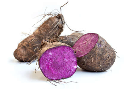 Fresh Dioscorea alata root isolated on a white backgroundの写真素材