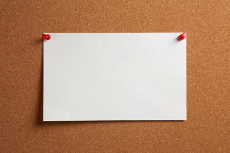 White notes with pin on wooden backgroundの写真素材