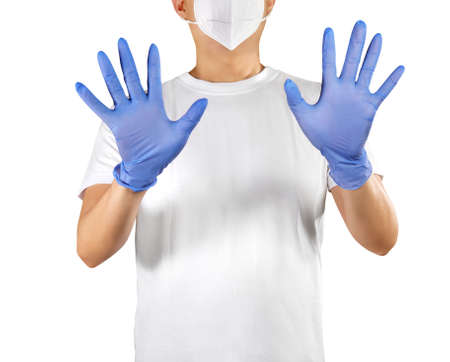 Man showing his hand with blue gloves isolated on whiteの写真素材