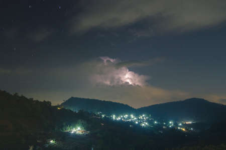 Night lightning strike over mountains resort with star on Mon Jam, Chiang Mai, Thailandの写真素材