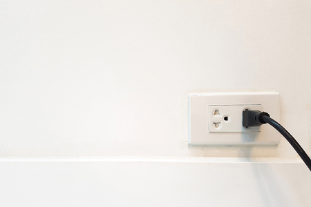 Electric cable in Electrical Outlet with ground wire on the Wall with copy space for label text. Power 250vの写真素材