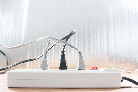 Plug the power plug, Multiple socket with connected plugs.の写真素材
